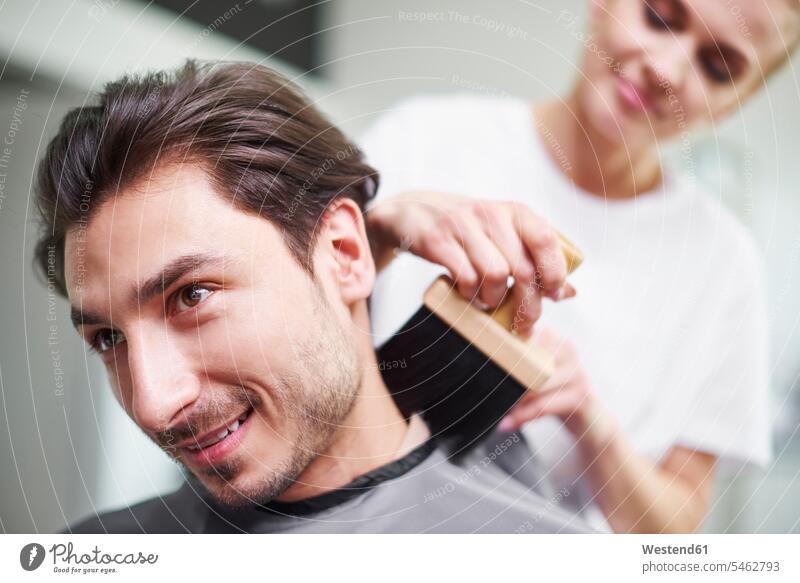 Portrait of smiling man at barber shop men males portrait portraits smile hair salon hair salons Adults grown-ups grownups adult people persons human being