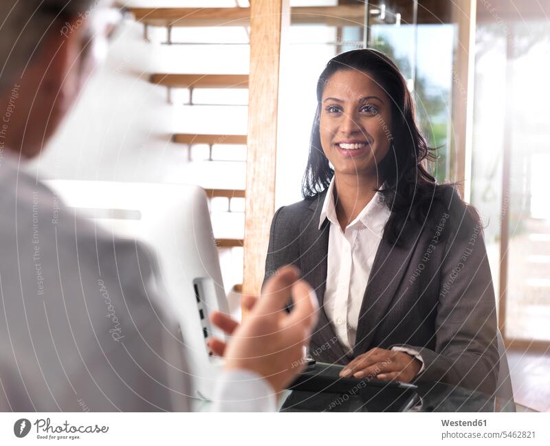 Portrait of smiling businesswoman in a meeting businesswomen business woman business women smile Business Meeting business conference portrait portraits