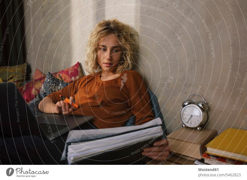 Portrait of blond student on bed working on laptop human human being human beings humans person persons caucasian appearance caucasian ethnicity european 1