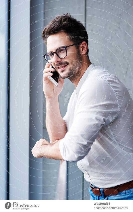 Portrait of businessman on the phone call telephoning On The Telephone calling Businessman Business man Businessmen Business men portrait portraits