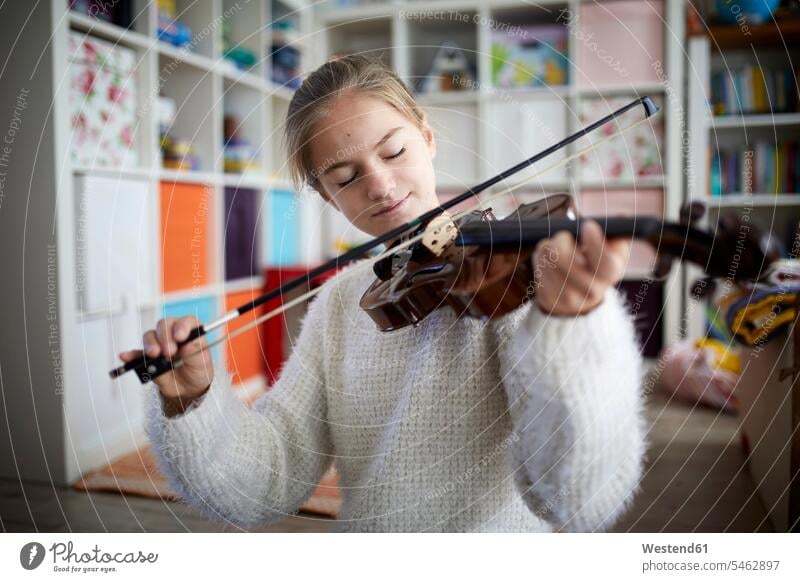 Girl exercising on her violin caucasian caucasian ethnicity caucasian appearance european musical instrument musical instruments Instruments practicing practice