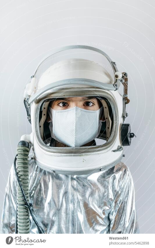 Boy wearing space suit and protective mask spacemen astronauts play at home free time leisure time protecting safe Safety secure dangerous indoor indoor shot