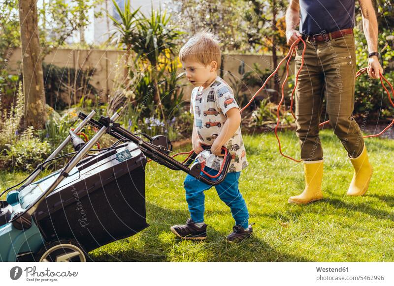 Toddler boy mowing the lawn with his father T- Shirt t-shirts tee-shirt lawnmower At Work work learn seasons summer time summertime summery free time