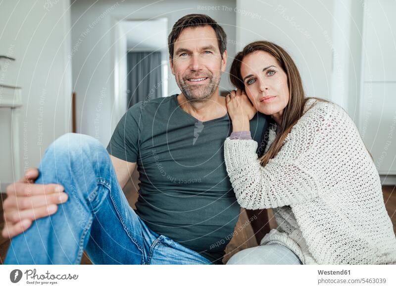 Mature woman leaning on shoulder of man at home color image colour image day daylight shot daylight shots day shots daytime Germany focus on foreground