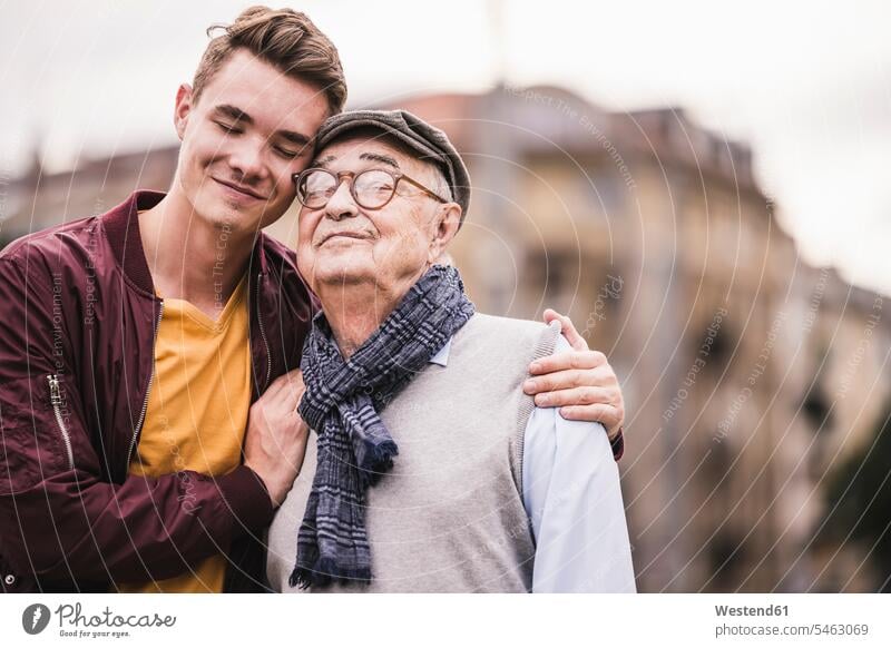 Portrait of happy senior man head to head with his adult grandson human human being human beings humans person persons caucasian appearance caucasian ethnicity