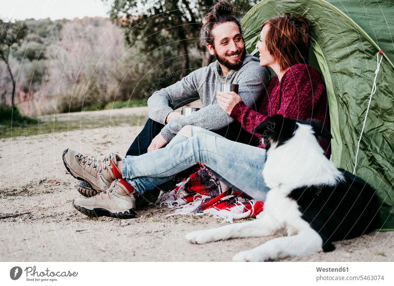 Happy couple with dog camping in the countryside human human being human beings humans person persons caucasian appearance caucasian ethnicity european 2