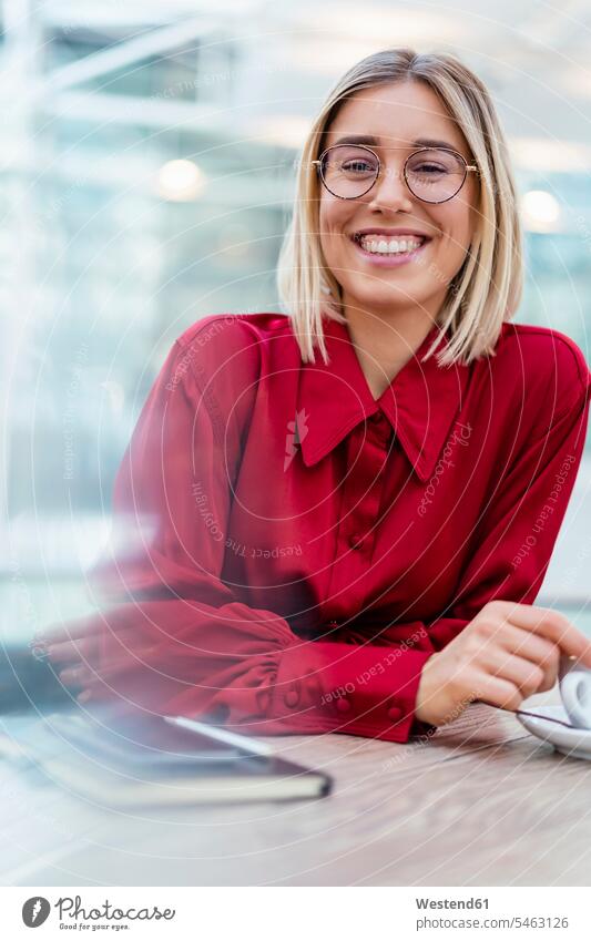 Portrait of happy young businesswoman in a cafe business life business world business person businesspeople business woman business women businesswomen Tables