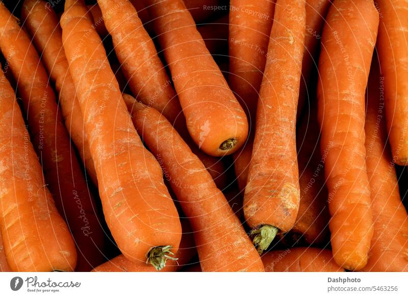 Extreme Closeup View of a Pile of Fresh Organic Carrots carrot vegetable food carrots nutrition nutritious nutritional vegetables vegetarian vegan crop plant