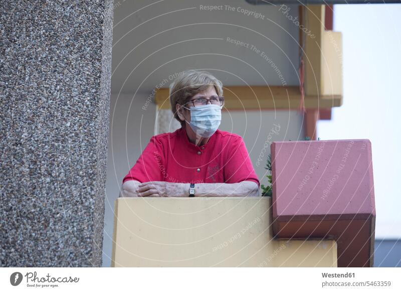 Senior woman wearing mask on balcony, retirement home Eye Glasses Eyeglasses specs spectacles contemplative pensively Reflective thoughtful aspirations Crave