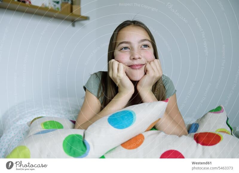 Portrait of smiling girl lying on bed females girls laying down lie lying down smile beds portrait portraits child children kid kids people persons human being