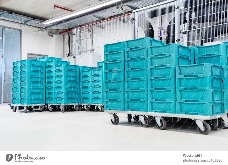 Turquoise colored containers inside modern factory warehouse, Stuttgart, Germany indoors indoor shot indoor shots interior interior view Interiors day