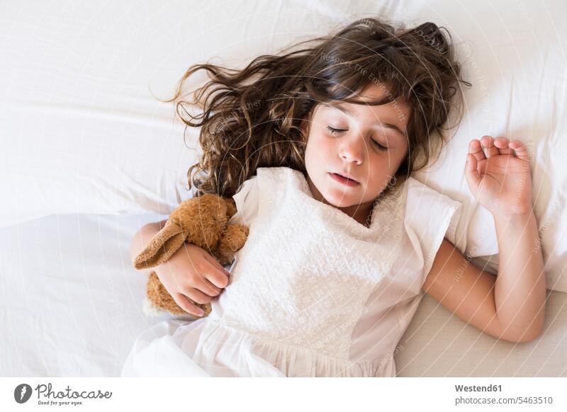 Little girl sleeping in bed beds females girls asleep child children kid kids people persons human being humans human beings Security Secure bright light clear