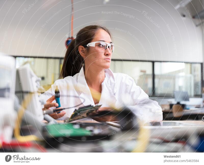 Female technician working in research laboratory female researcher female technician female technicians thinking engineer female engineer engineers