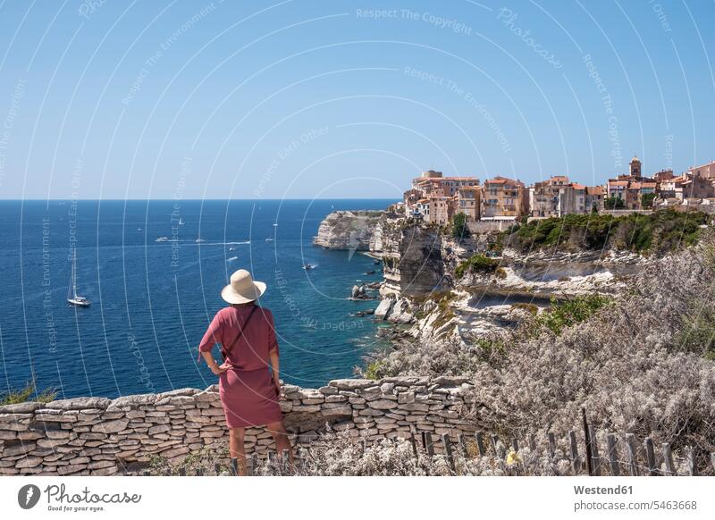 Corsica, Bonifacio, woman standing on viewpoint looking to the city females women Wanderlust Itchy Feet View Vista Look-Out outlook coastal town coastal city