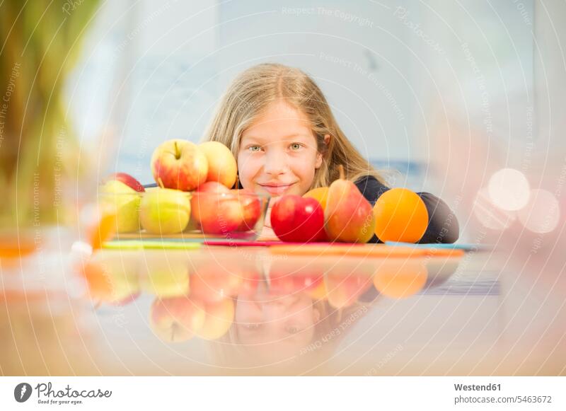 Portrait of smiling girl with various fruits smile Fruit Fruits portrait portraits different females girls Food foods food and drink Nutrition Alimentation