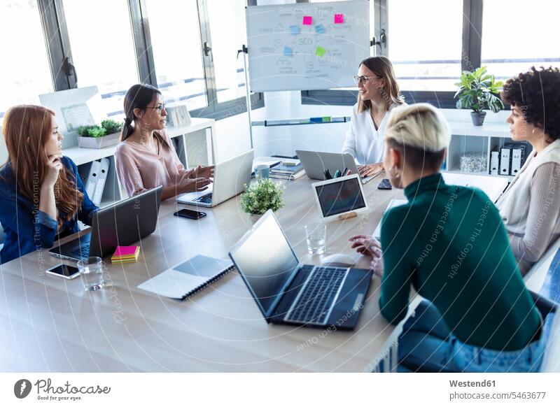 Businesswomen during meeting in an office Occupation Work job jobs profession professional occupation business life business world business person