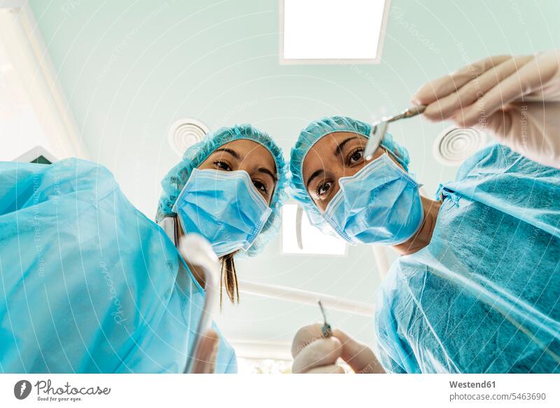 Dentist and nurse working in clinic color image colour image indoors indoor shot indoor shots interior interior view Interiors Spain white collar worker