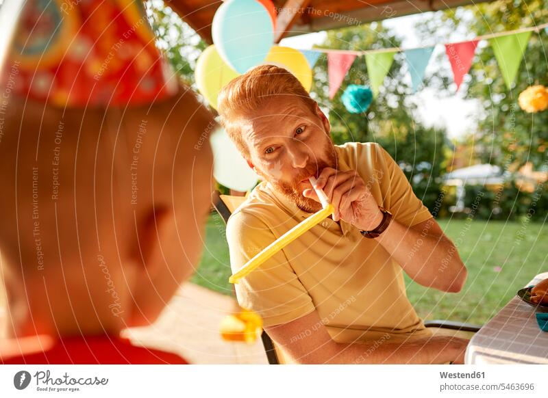 Playful father with son on a garden birthday party gardens domestic garden Garden Party Garden Parties Birthday Party Birthday Parties Celebration Celebrations