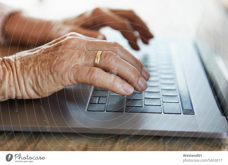 Hand of senior woman typing on keyboard of laptop, close-up Laptop Computers laptops notebook keyboards hand human hand hands human hands using use senior women