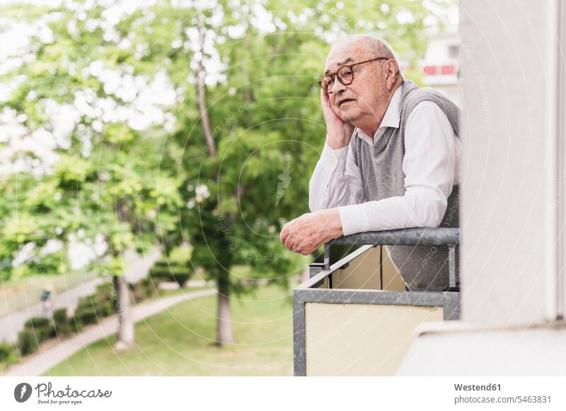 Portrait of senior man standing on balcony looking at distance human human being human beings humans person persons celibate celibates singles solitary people