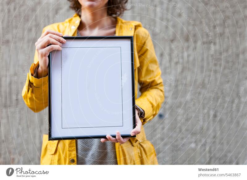 Close-up of woman holding blank frame Frame empty emptiness females women Adults grown-ups grownups adult people persons human being humans human beings