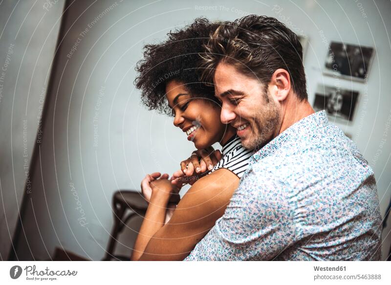Close-up of romantic couple embracing while dancing in bar color image colour image indoors indoor shot indoor shots interior interior view Interiors