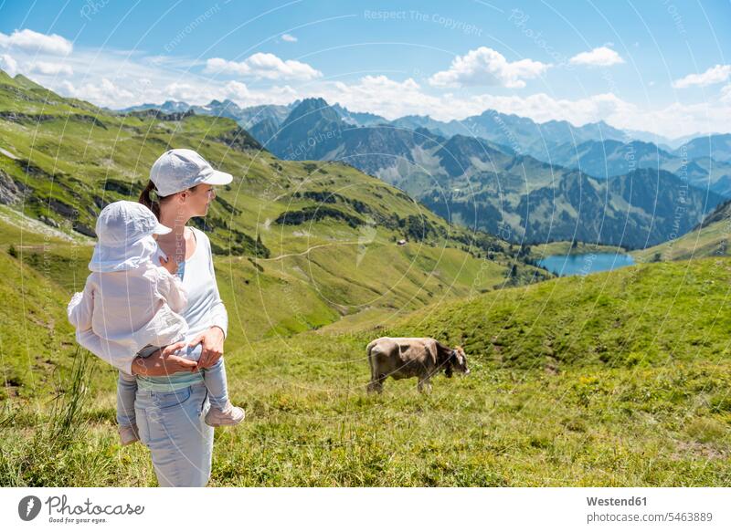 Germany, Bavaria, Oberstdorf, mother and little daughter on a hike in the mountains hiking daughters mommy mothers mummy mama mountainscape mountainscapes