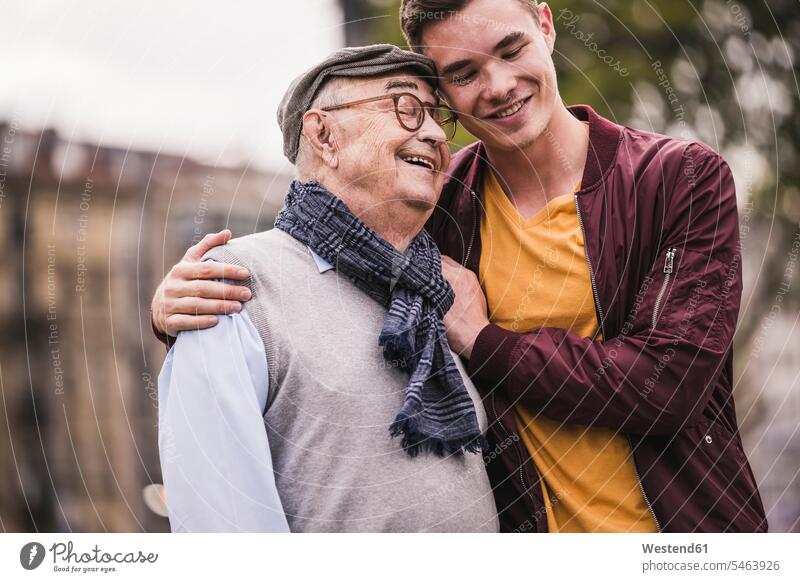 Happy senior man head to head with his adult grandson outdoors human human being human beings humans person persons caucasian appearance caucasian ethnicity