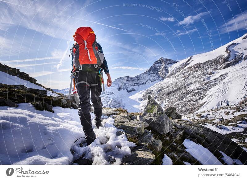 Rear view of female mountaineer, Glacier Grossvendediger, Tyrol, Austria human human being human beings humans person persons caucasian appearance