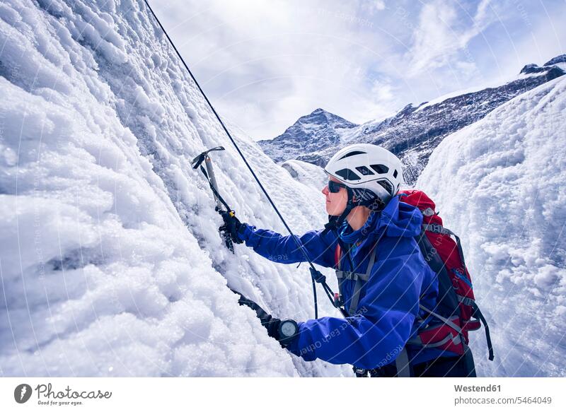 Female mountaineer, Glacier Grossvendediger, Tyrol, Austria helmets Protective Headwear climb seasons hibernal chilly Cold Temperature Cold Weather free time