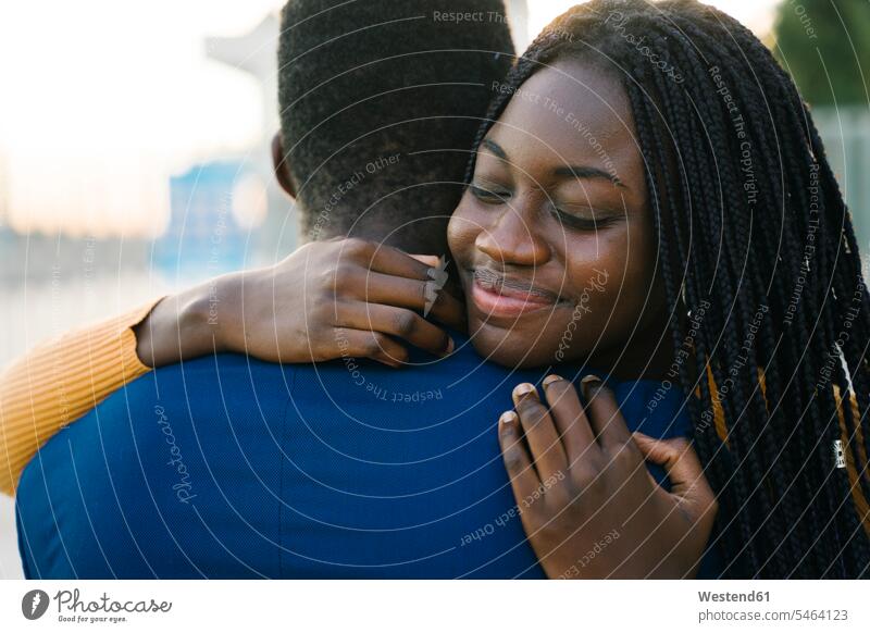 Heterosexual couple embracing each other outdoors color image colour image location shots outdoor shot outdoor shots day daylight shot daylight shots day shots