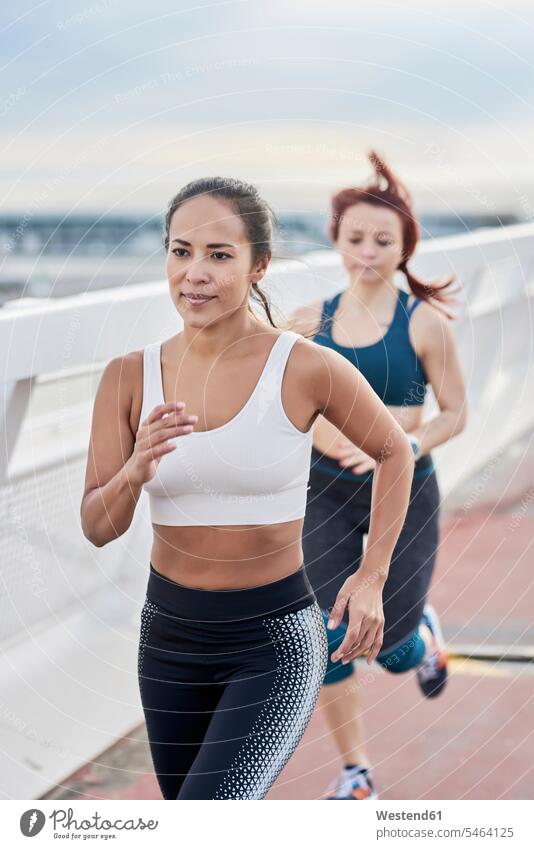 Female athletes running on a bridge workout working out work out bridges jogger joggers female jogger sportswoman female athlete sportswomen female athletes