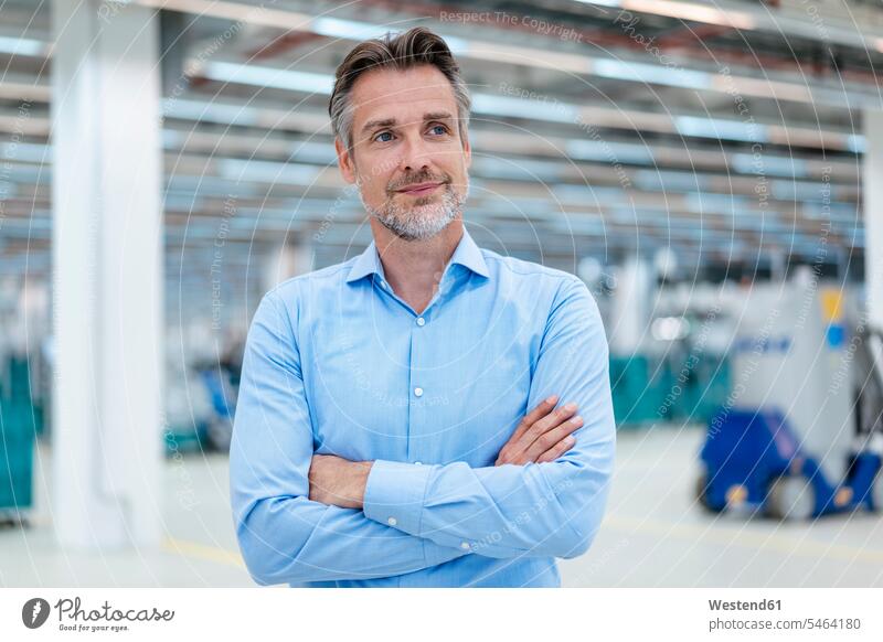 Portrait of confident businessman in a factory hall human human being human beings humans person persons caucasian appearance caucasian ethnicity european 1