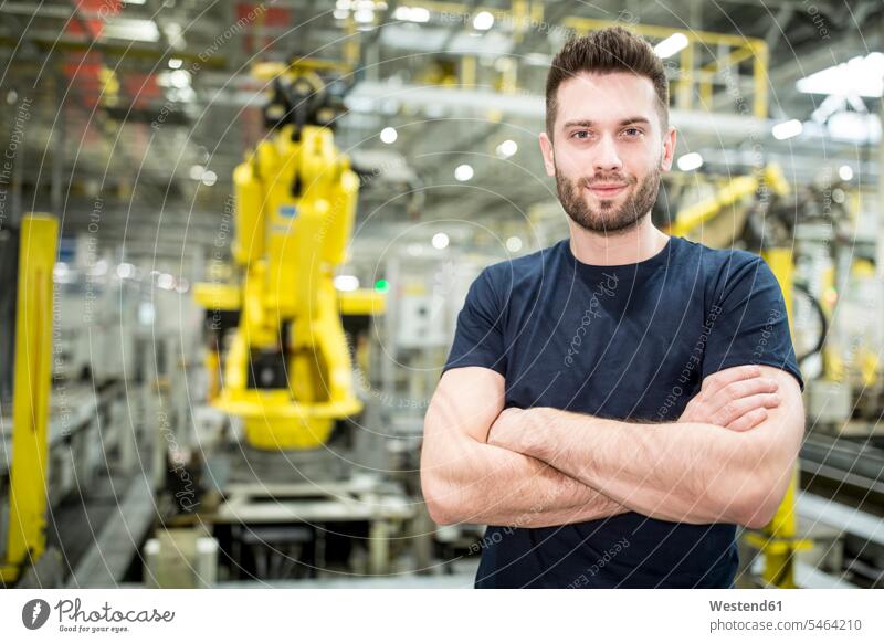 Portrait of confident worker in a modern factory Occupation Work job jobs profession professional occupation blue collar blue collar worker blue-collar worker