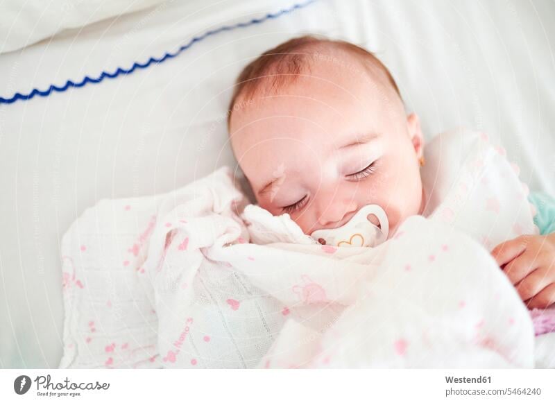 Portrait of sleeping baby girl with pacifier Blankets Bed - Furniture beds comforter Pacifiers soother relax relaxing asleep content Contented Emotion pleased