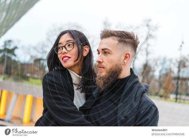 Portrait of young couple looking at distance twosomes partnership couples portrait portraits people persons human being humans human beings Love loving