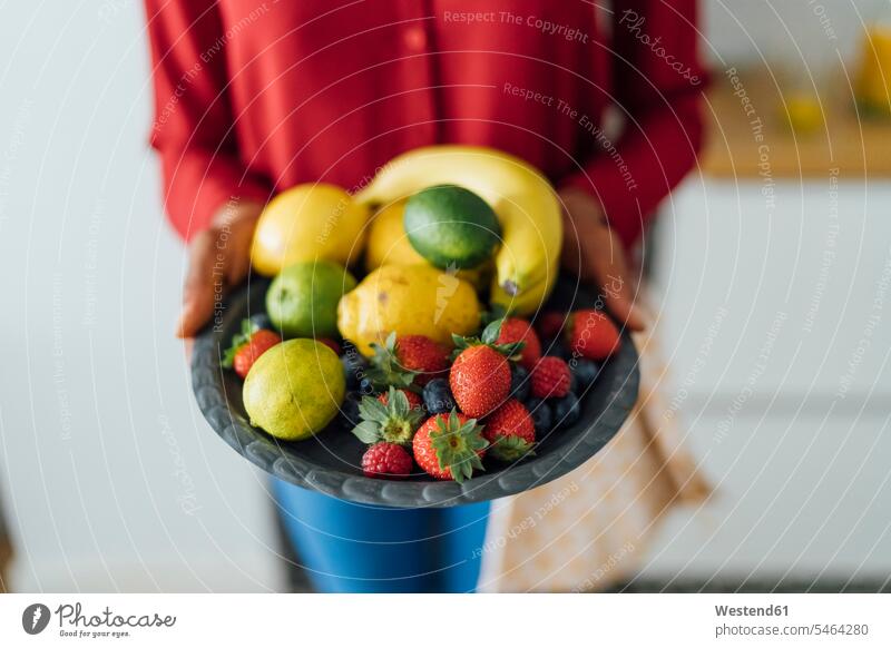 Woman holding plate with fruit Fruit Fruits hand human hand hands human hands fruit bowl fruit bowls Food foods food and drink Nutrition Alimentation