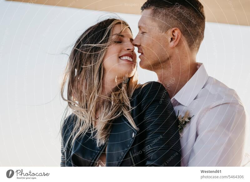 Affectionate bride and groom kissing outdoors human human being human beings humans person persons caucasian appearance caucasian ethnicity european 2 2 people