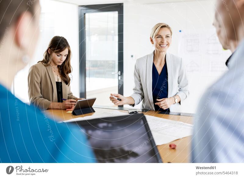Businesswoman leading a meeting in office Occupation Work job jobs profession professional occupation business life business world business person