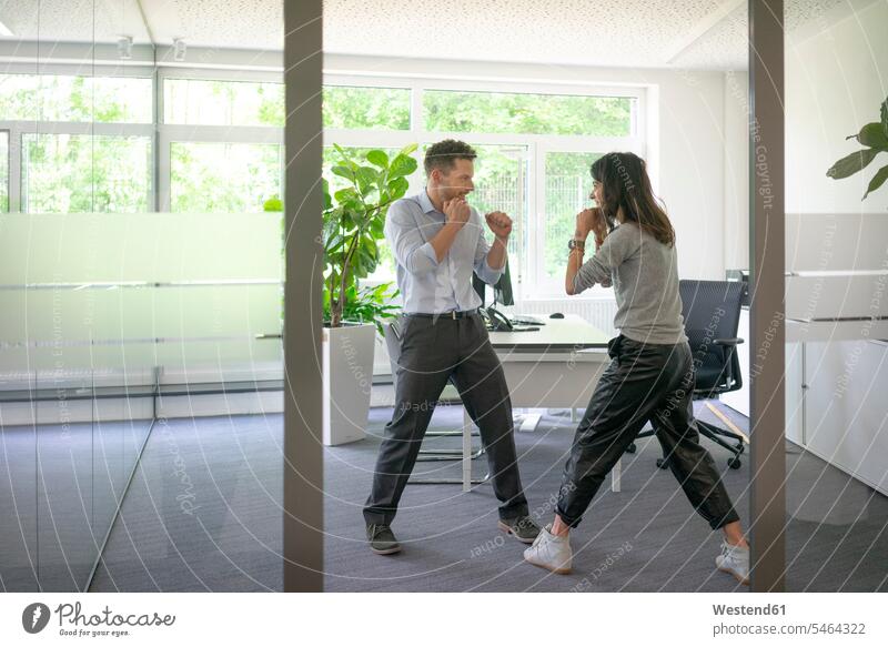 Businessman and businesswoman fighting in office colleague Occupation Work job jobs profession professional occupation business life business world