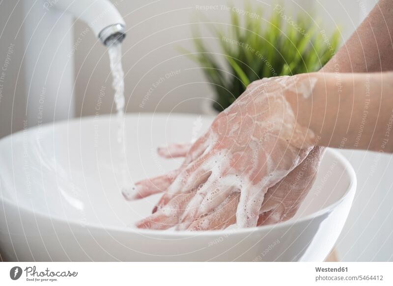 Close-up of woman washing her hand with soap Contemporary indoor interior shot indoors interiour photo interiour photos interiour shots detail close-up