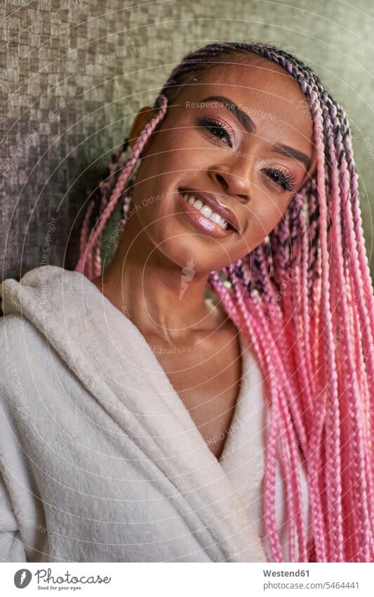 Portrait of young woman with pink braids bath robe bath robes bathrobes smile delight enjoyment Pleasant pleasure Contented Emotion pleased colour colours Rosy