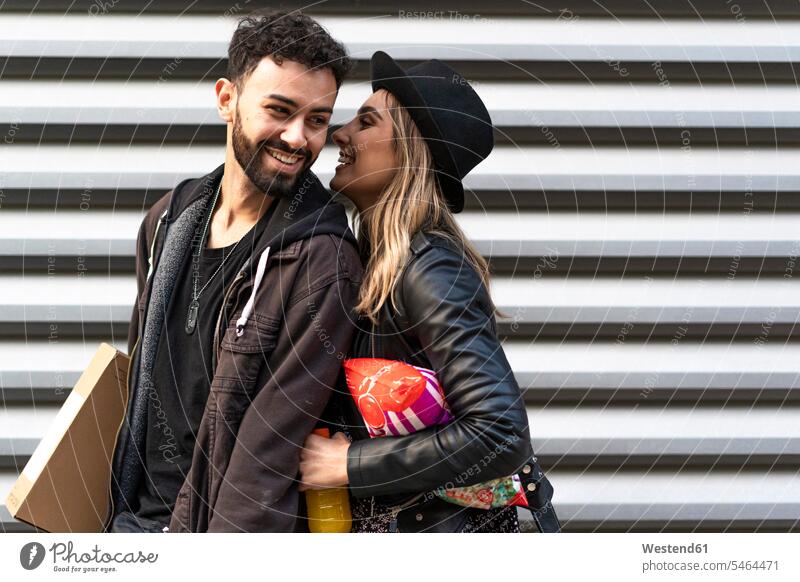 Happy young couple with purchases in the city human human being human beings humans person persons caucasian appearance caucasian ethnicity european 2 2 people