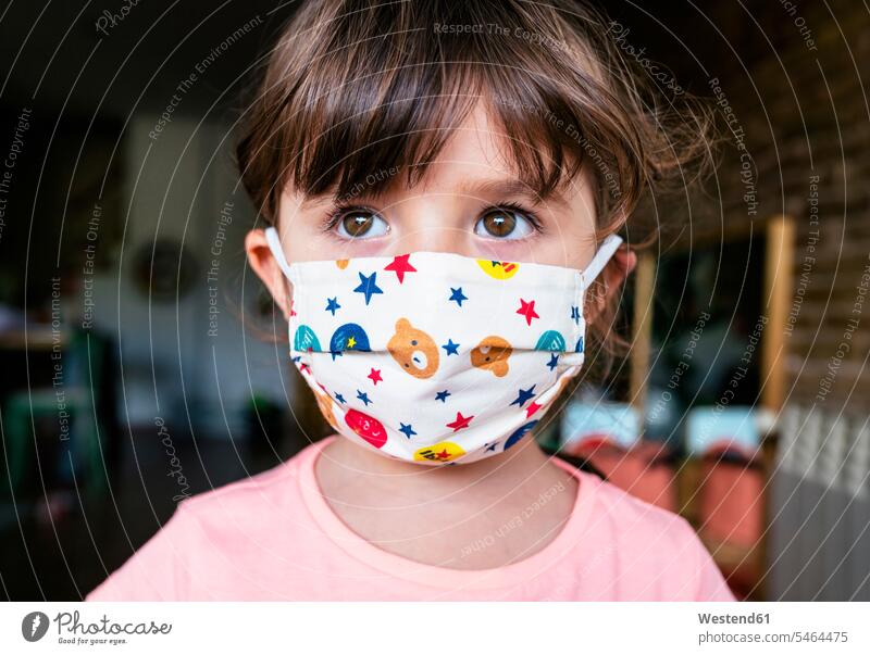 Portrait of girl with a colorful mask Rosy star stars at home free time leisure time healthy protect protecting safe Safety secure location shot location shots