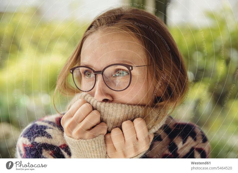 Young woman with glasses wearing fluffy sweater looking sideways heads faces human face human faces jumper Sweaters Eye Glasses Eyeglasses specs spectacles