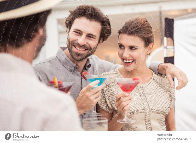 Couple and friend socializing on a cocktail party human human being human beings humans person persons caucasian appearance caucasian ethnicity european Group