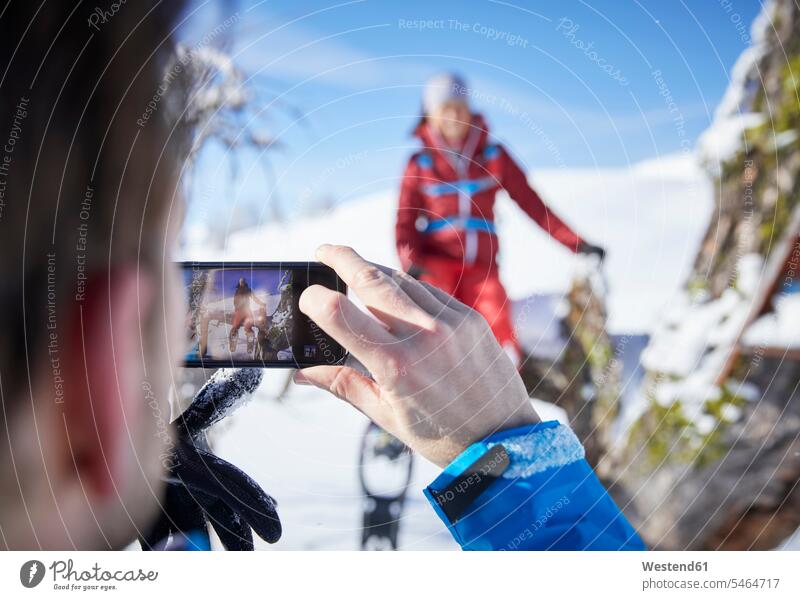 Austria, Tyrol, hiker taking a photo with smartphone wanderers hikers leisure free time leisure time Social Media Smartphone iPhone Smartphones photographing