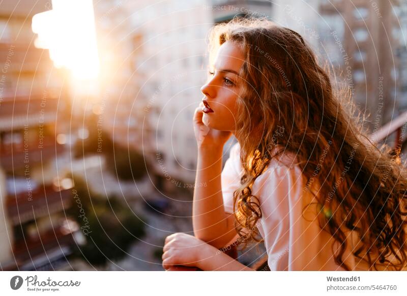 Portrait of beautiful young woman on balcony at sunset human human being human beings humans person persons caucasian appearance caucasian ethnicity european 1