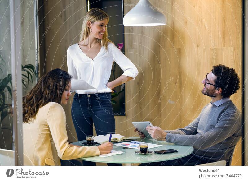Three business people having a meeting in modern office human human being human beings humans person persons caucasian appearance caucasian ethnicity european