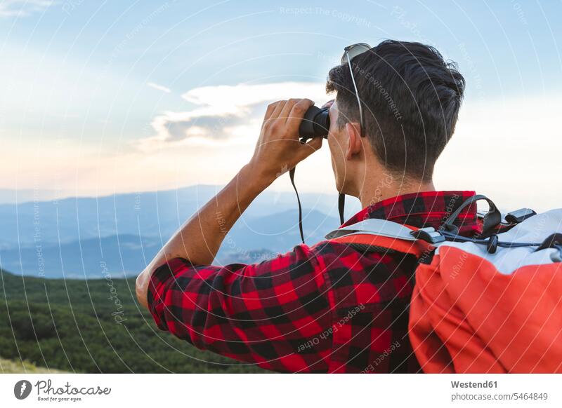 Italy, Monte Nerone, hiker in the mountains looking with binocular Panorama man men males view seeing viewing hiking binoculars Adults grown-ups grownups adult